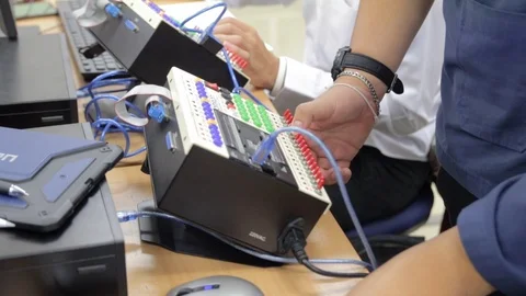 Student Working on Programmable Logic Controller PLC Device During Training Stock Footage 118714635