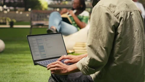Student working on programming code on laptop during study session Stockbeeldmateriaal 340961562