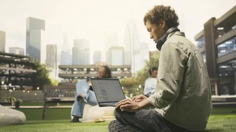 Student working on programming code on laptop during study session Stock Photos