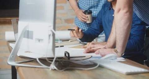 Student working on project. Group of diverse people in early 20s collaborating Stock-Footage 107742454