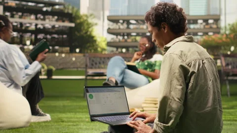 Student working with renewable energy data on laptop Stock Footage 340961556