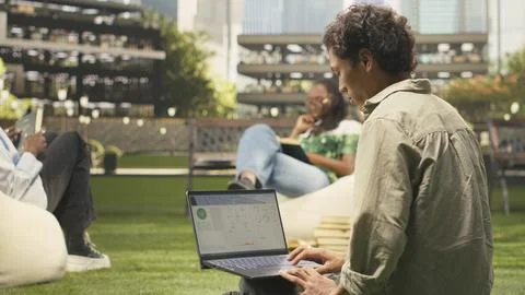 Student working with renewable energy data on laptop Stock Photos