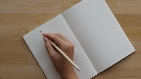 Student write Chinese character in notebook with pencil Stock Footage 91644375