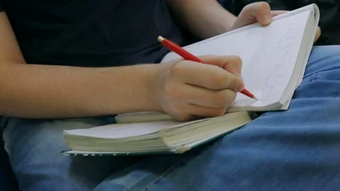 Student write formulas in notebook Stock Footage 83586311