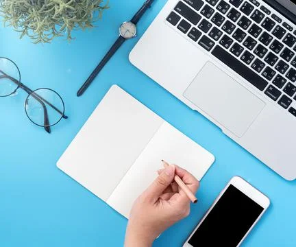 A student write on open white book or accounting isolated on a minimal clean  Foto stock