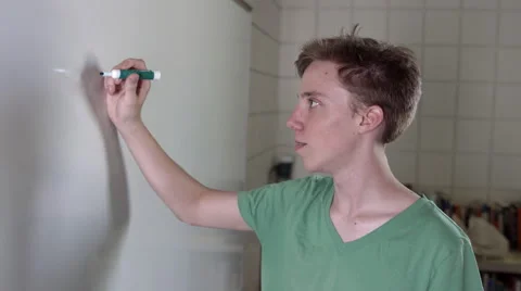 Student writes "Know Thyself" in Latin on white board 4K Stock Footage 41176081