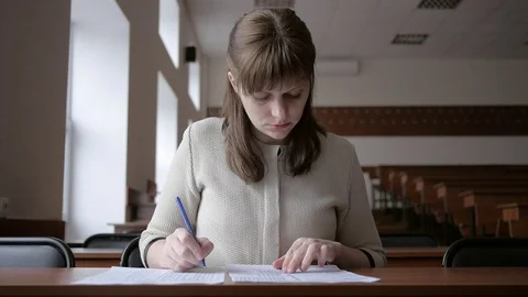 Student writes in the paper exam Stock Footage 72918514