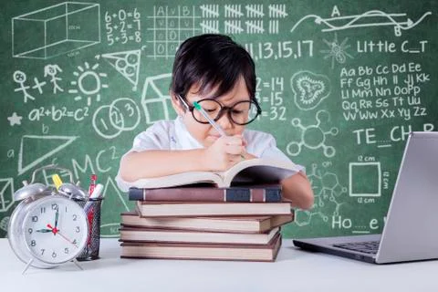 Student writing in the classroom Stock Photos