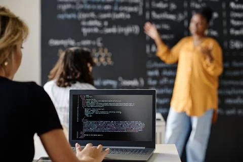 Student writing codes on laptop at class Stock Photos