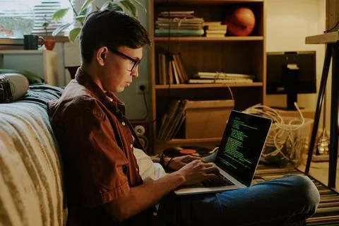 Student Writing Codes via Laptop Stock-Fotos