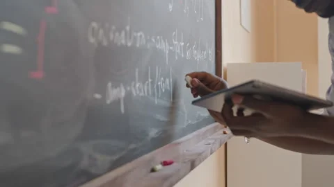 Student Writing Computer Code on Blackboard Stock Footage 257063705