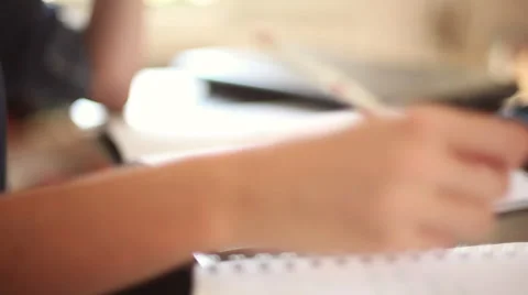 Student writing homework Stock Footage 63284229