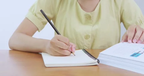 Student writing note classroom educational environment close-up view learning 動画素材 313934561