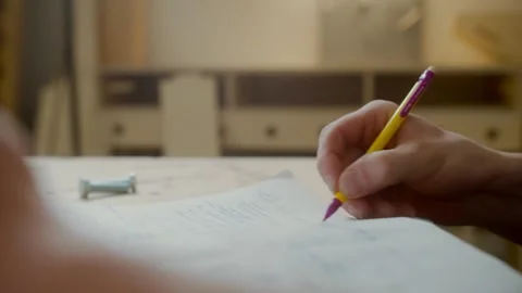 Student writing in the notebook with pen close up Stock Footage 150877289