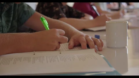 Student Writing in Notebook with Pen Close-Up in Classroom Stock-Footage 333706629