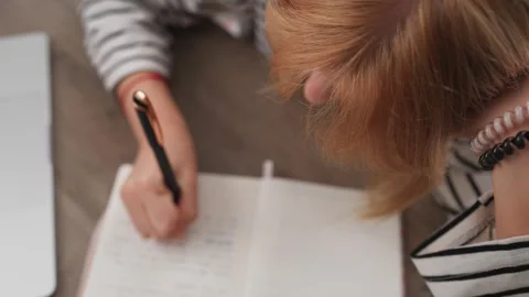 Student writing in notebook. Woman taking notes in diary with pen. Girl stu.. Stock Footage 344020911