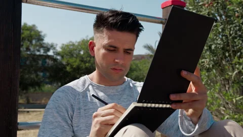 Student Writing Notes In The Park Stock Footage 276852736