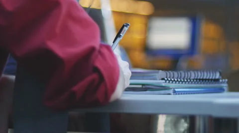 Student writing notes in study room 4K Video stock 46994339