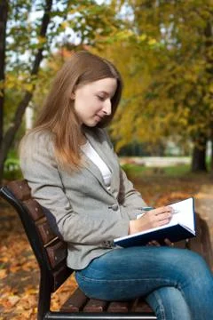 Student writing by pen in notebook Stock Photos