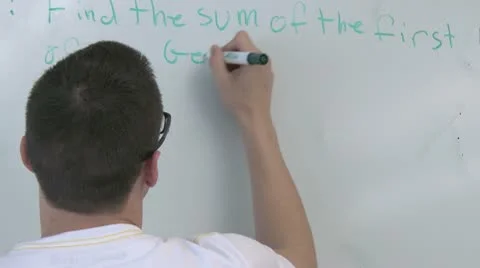 Student writing on white board in front of class (3 of 3) Video stock 10336046