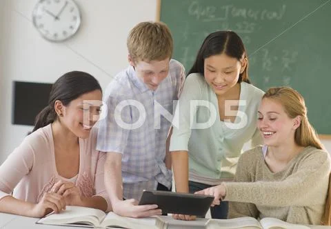 Students (14-19) using tablet pc in classroom Stock Photos