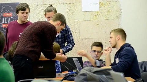 Students adjust the computer during Data Science Hackathon in Kiev, Ukraine. Video stock 72080545