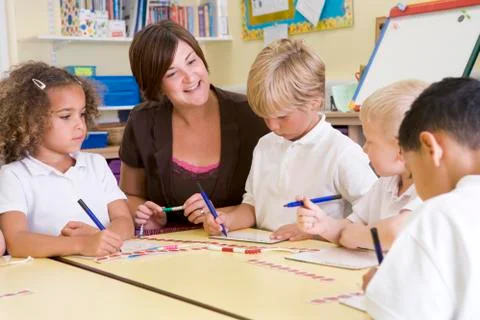 Students and teacher in math class with counting beads Stock Photos