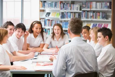 Students and teacher in a study group collaborating Stock Photos