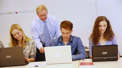 Students and teacher working on computer Stock Footage 33467927
