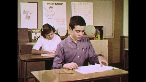Students answer exams using a pencil to mark scantron papers. Stock Footage 74453045