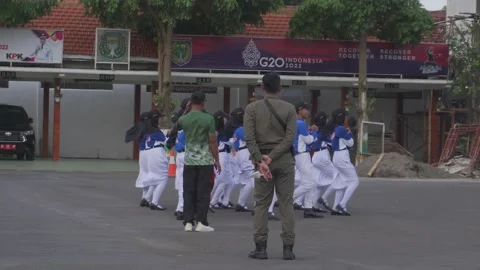 Students are doing Ceremonial Practice Stock Footage 220033769