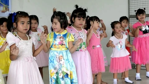 The students are performing on stage. Stock Footage 99753510