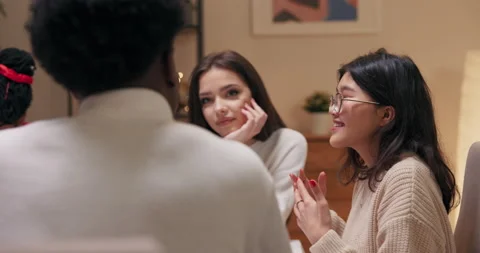 Students are sitting at the table and talking. Girl of Asian appearance with Vídeo Stock 218269490