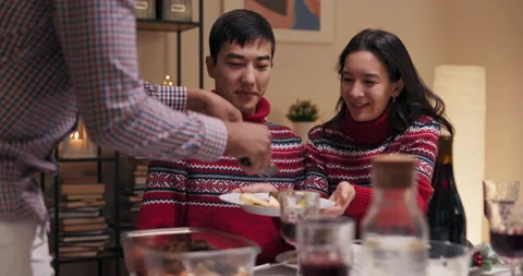 Students are sitting at the table and celebrating friend's birthday. Girl and 動画素材 218270026