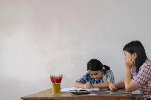 Students are solving mathematical problems concept.The teacher is teaching an Stock Photos