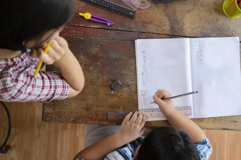 Students are solving mathematical problems concept. The teacher is teaching a Stock Photos