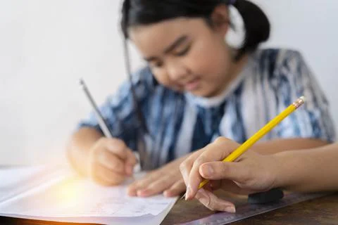Students are solving mathematical problems. The teacher is teaching an Asian  Stock Photos