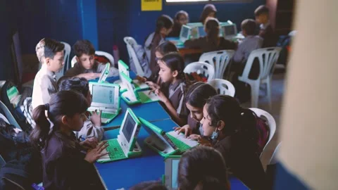 Students are using laptops in a classroom setting at a school They are learning Stock Footage 330873177