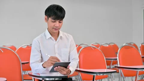 Students are writing down what the teacher teaches.	 Stock Footage 224355383