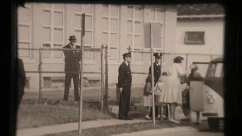 Students Arrive at School During Segregation, Parents Drop Off, Police Escort  Stock Footage 130697037