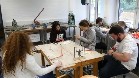 Students in art class create a work of art Stock Footage 69303611