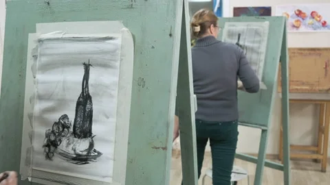 Students of the art school draw with paints on canvas Stock Footage 144948747