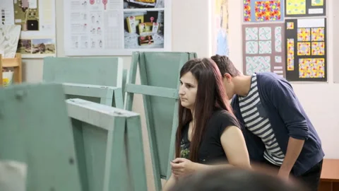 Students of the art school draw with paints on canvas Stock Footage 144950396