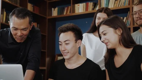 Students asian multi ethnics together group teenager studying smile with laptop Video stock 98685390