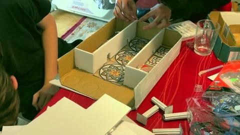 Students assemble a Roman house model for a school project 스톡 동영상 336733760