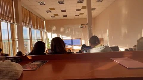 Students attending a lecture in a classroom Stock Footage 291741654
