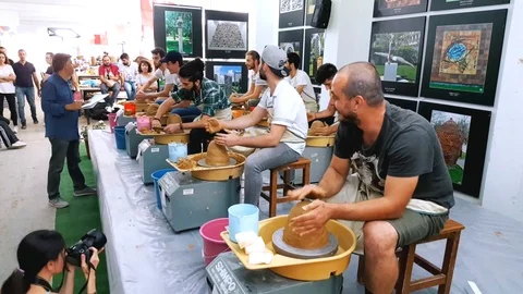 Students attending to the pottery contest at the 12th International Eskisehir Stock Footage 104076755