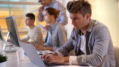 Students attending web design class with teacher Stock Footage 86521312