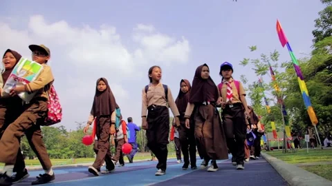 Students with Boy Scout (Pramuka) Uniform Walking at Jogging Track Stock Footage 132294867