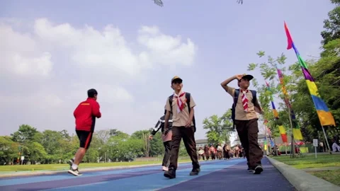 Students with Boy Scout (Pramuka) Uniform Walking at Jogging Track Stock Footage 132295407